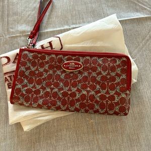 Coach wristlet, never carried 4”x8”